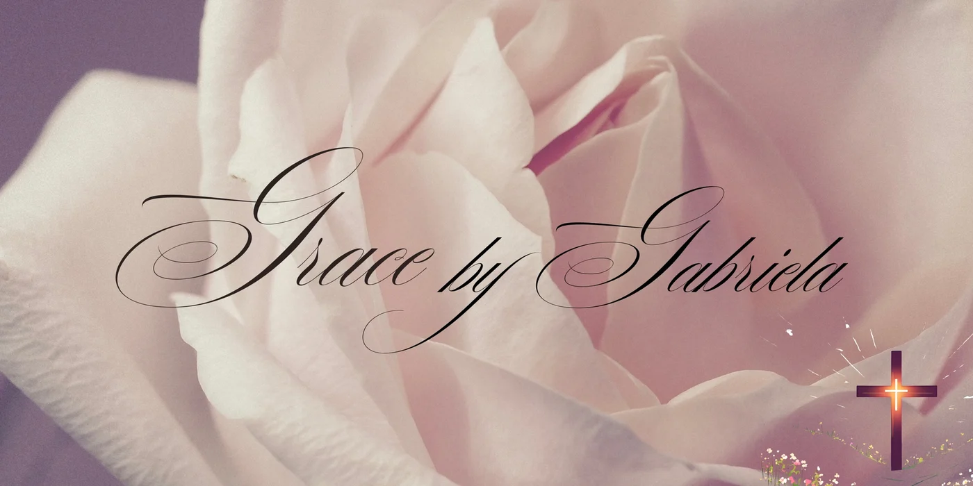 Gabriela’s original Grace by Gabriela design with soft rose petals, calligraphy and a cross